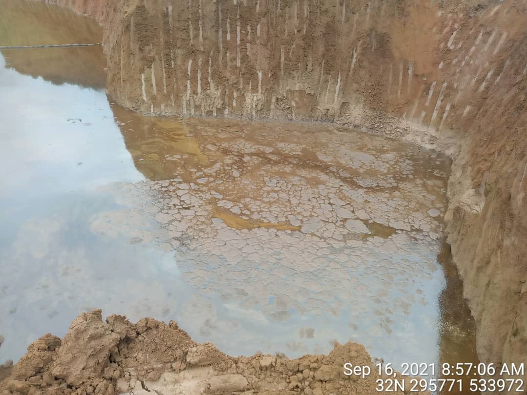 Excavation pit containing contaminated water